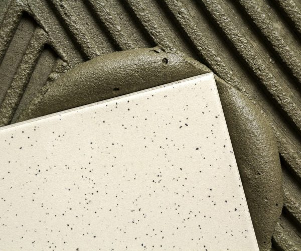 Ceramic tiles and tools for tiler. Floor tiles installation. Home improvement, renovation