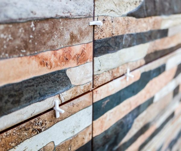 Tile spacers, plastic pieces to separate tiles during installation.